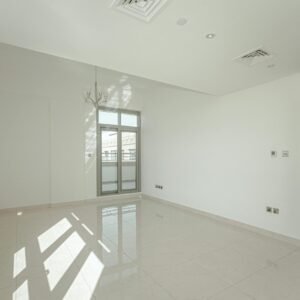 Bright and spacious white room interior with natural light and minimalist design, ideal for real estate presentations.